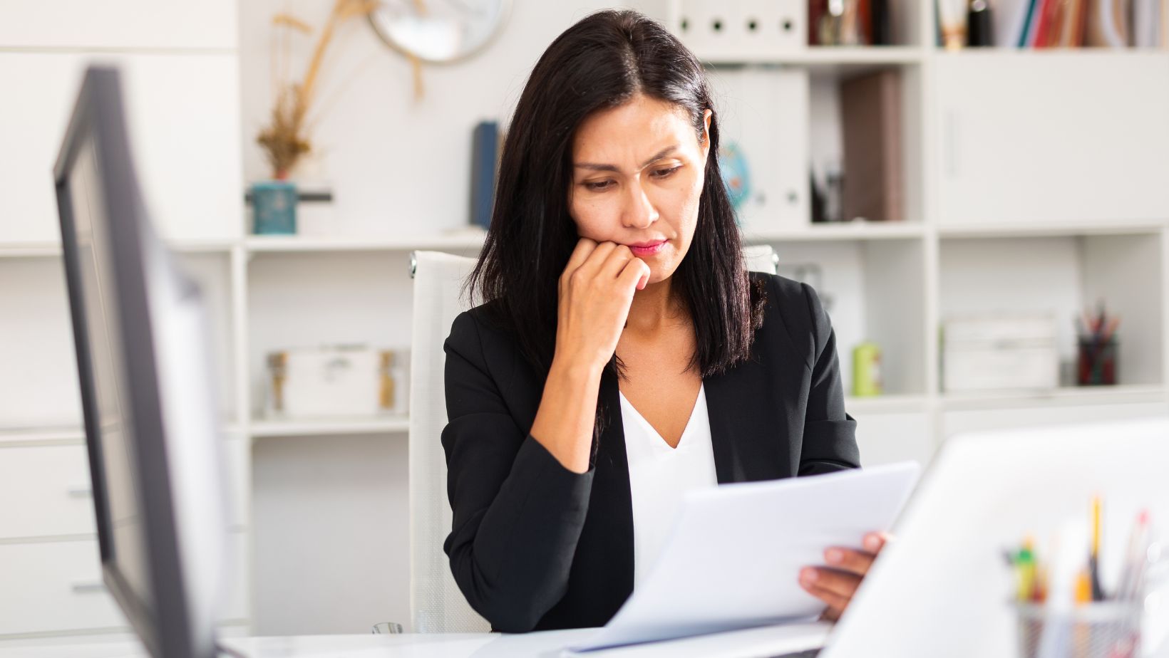 Business woman looking concerned, reflecting the challenges and uncertainties of entrepreneurship