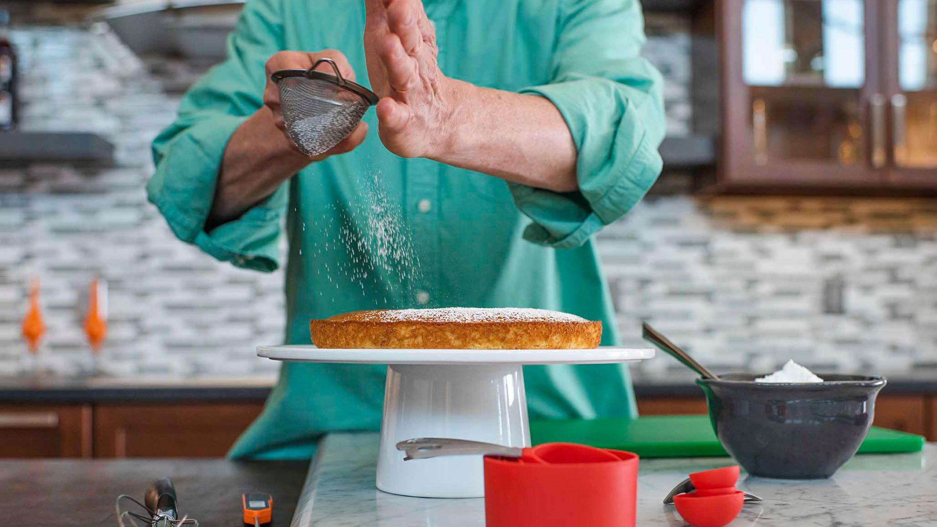A chef demonstrates how to prepare a dessert