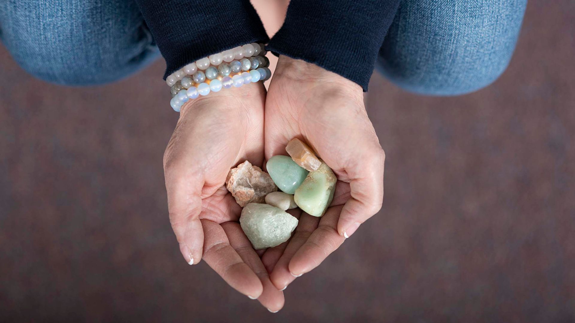A health and wellness practitioner holds some of the tools of her trade.
